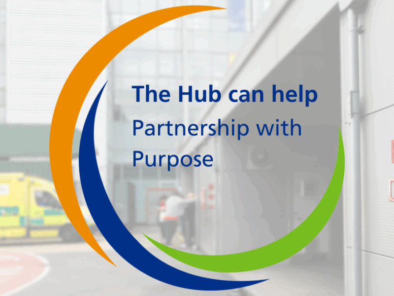 A semi transparent image of the outside of an emergency department with an ambulance parked and people standing next to it. With Hub branding imposed over and text saying 'The Hub can help - partnership with purpose'